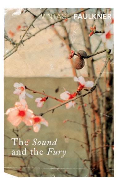 Book cover of 'The Sound and the Fury' by William Faulkner with floral design.