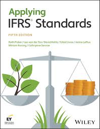 Book cover of 'Applying IFRS Standards' by Wiley with a balance scale and leaves on the cover.